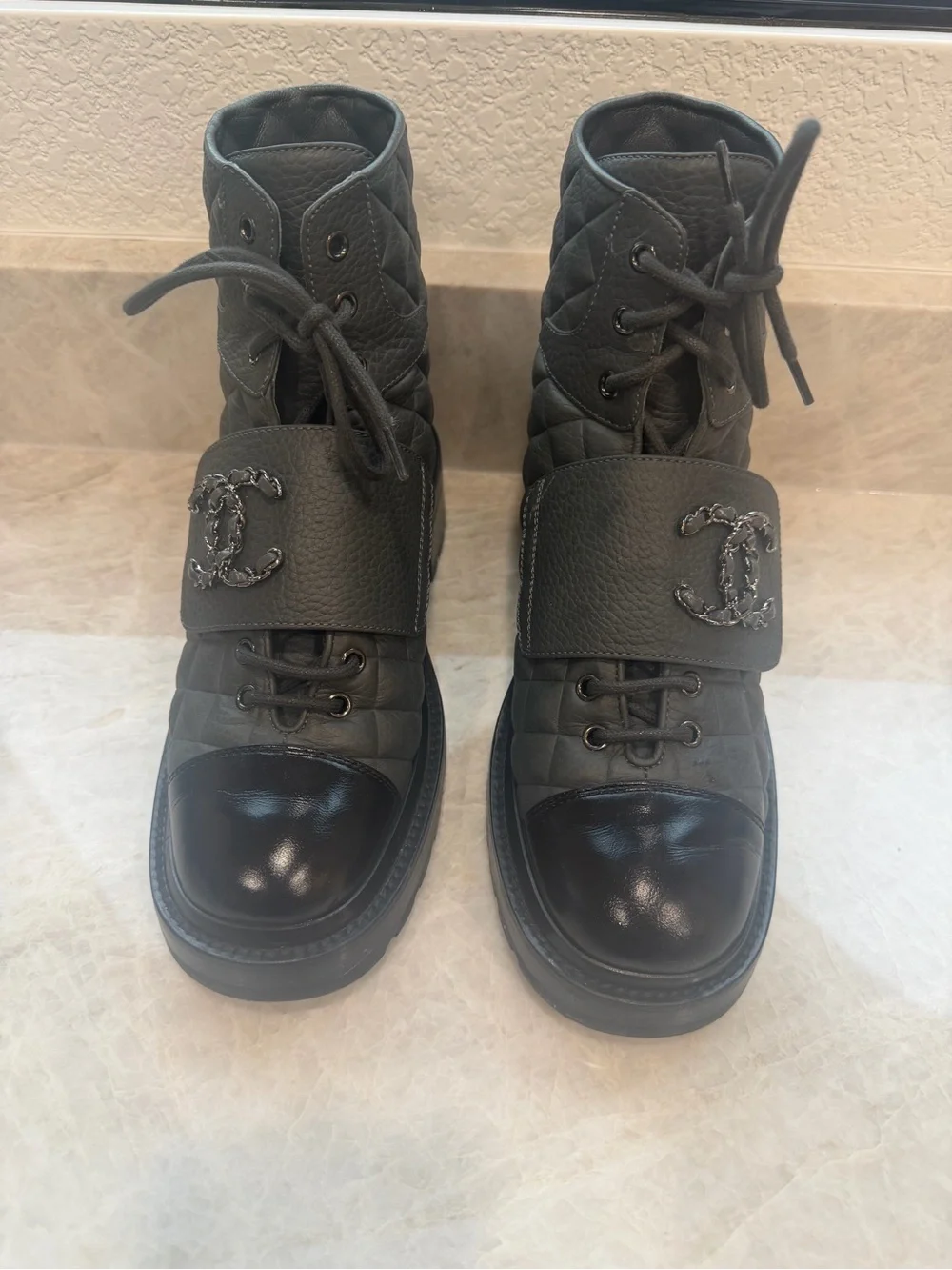 CHANEL Black Quilted Leather Combat Boots with Patent Toe